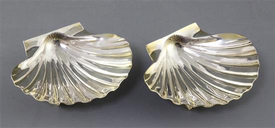A pair of 1960s parcel gilt silver butter shell dishes, by William Comyns & Sons Ltd, 18 oz.